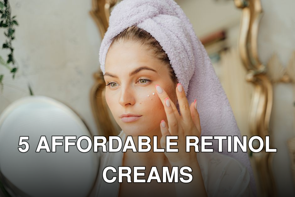 Woman with head towel applying moisturizer in front of mirror indoors.