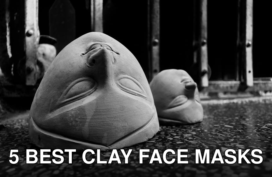 Black and white photo of clay Durga idol faces in Kolkata workshop.