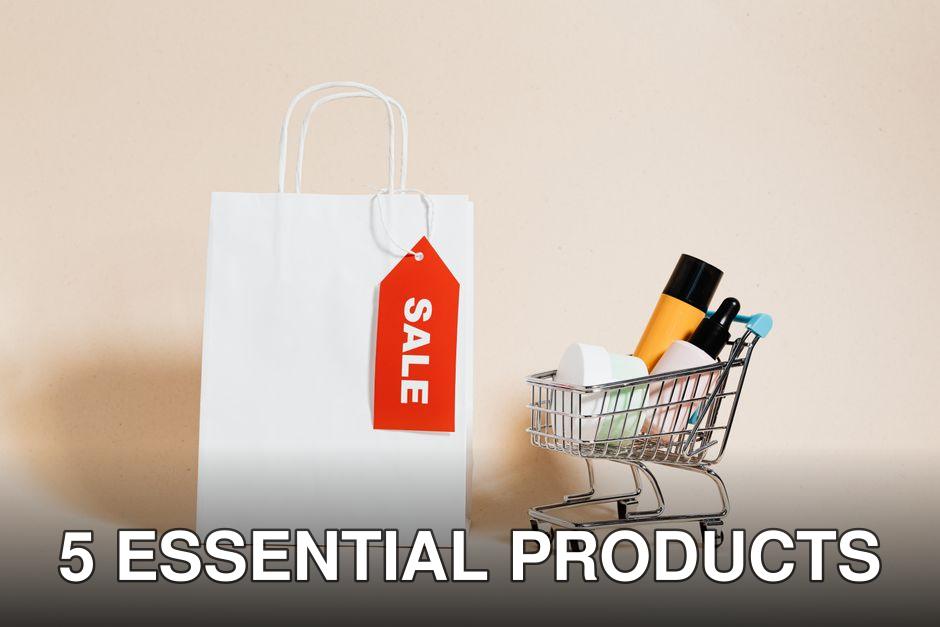 White shopping bag with red sale tag and mini shopping cart on beige background.