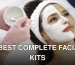 From above closeup of crop faceless cosmetologist applying white clay mask with brush to female clients face during procedure in spa center