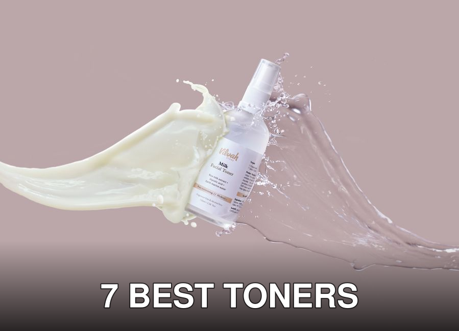 High-speed capture of milk and water splashing around a facial toner bottle, highlighting skincare product.