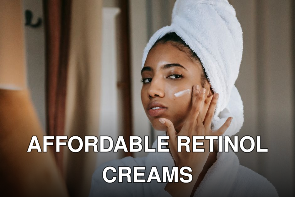 Young attentive ethnic female in bathrobe applying smear of moisturizing cream on face while looking in mirror at home