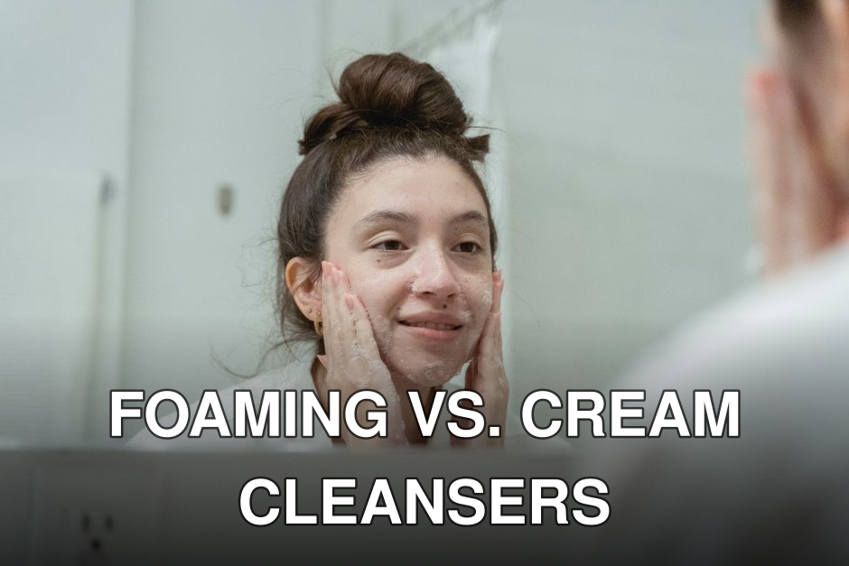 A woman smiling as she applies facial cream in front of a bathroom mirror, enhancing skincare routine.