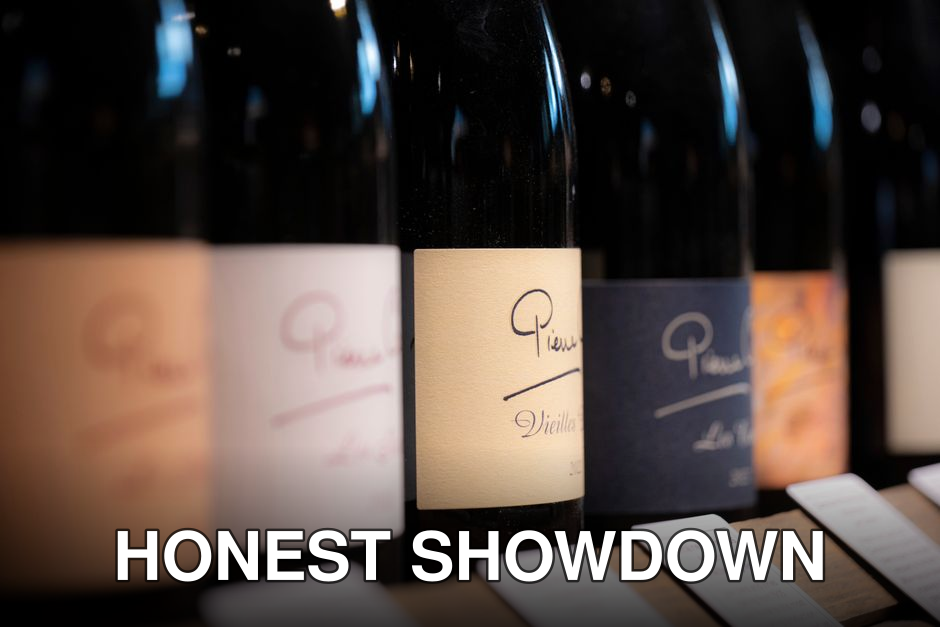 A variety of wine bottles with different labels neatly arranged, highlighting premium selections.