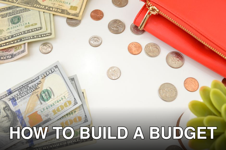 Dollar bills and change scattered near a red wallet on a white surface with a plant accent.