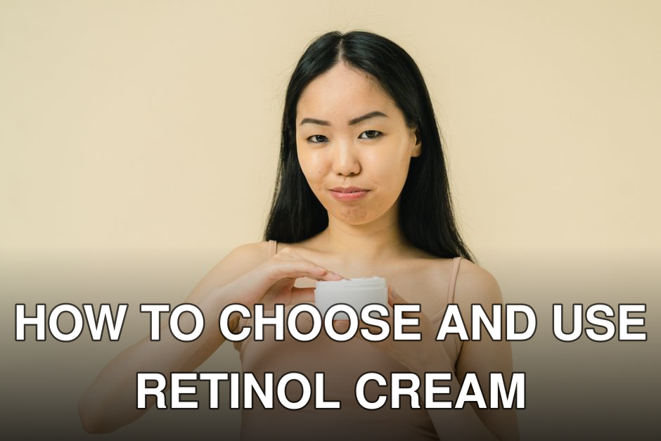 A woman with long black hair holding a cream jar in a studio setting, wearing neutral colors.