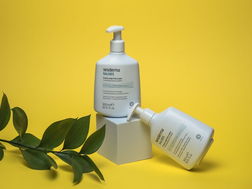 Sesderma Foamy Cream Soap displayed with modern design on bold yellow backdrop.
