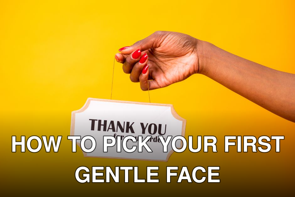 A hand holding a thank you sign on a bright yellow background, expressing gratitude.