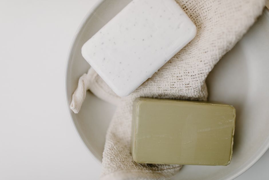 A minimalist display of organic soap bars resting on fabric, perfect for self-care.