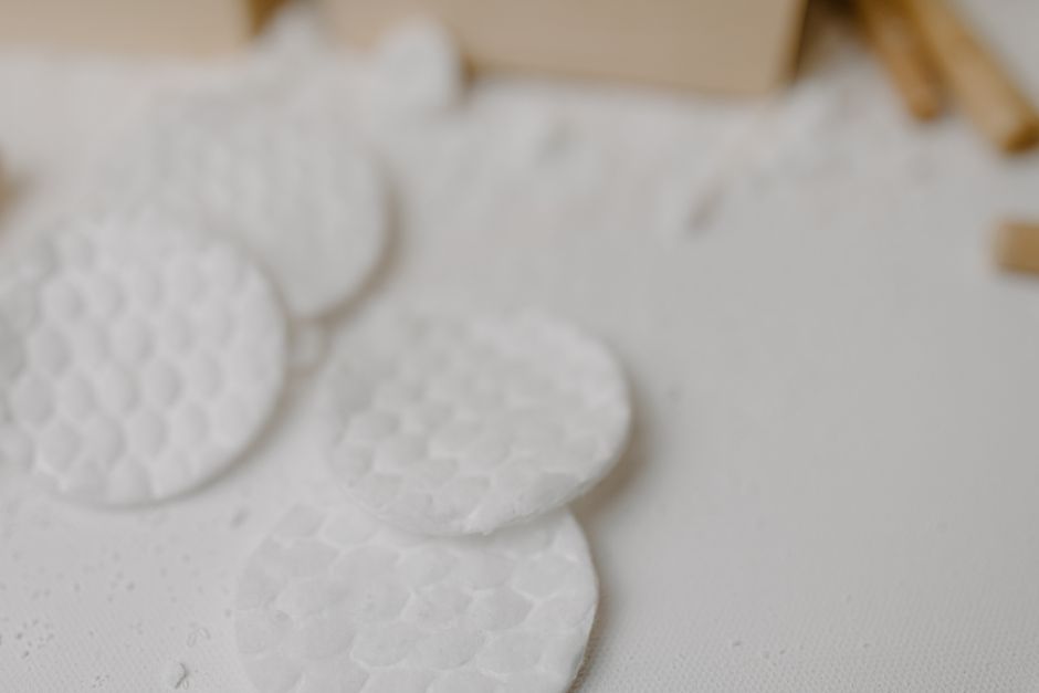A close-up of textured cotton pads for skincare and exfoliation in a minimalist style.