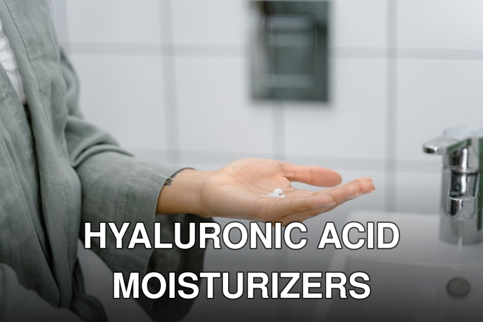 A close-up of a hand holding cream near a modern bathroom sink.