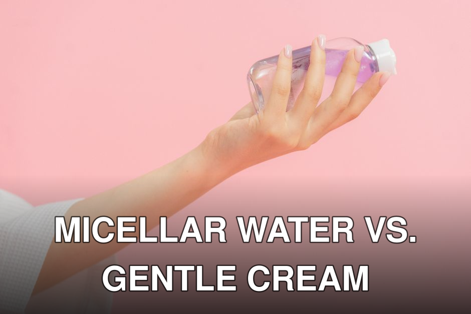 Close-up of a hand holding a clear plastic skincare bottle against a pastel pink background.