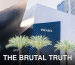 Contemporary architecture of the Prada storefront on Las Vegas Strip with palm trees and unique design.