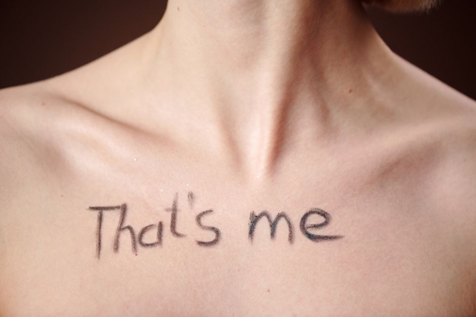 Artistic close-up of a chest with the handwritten message 'That's me'.