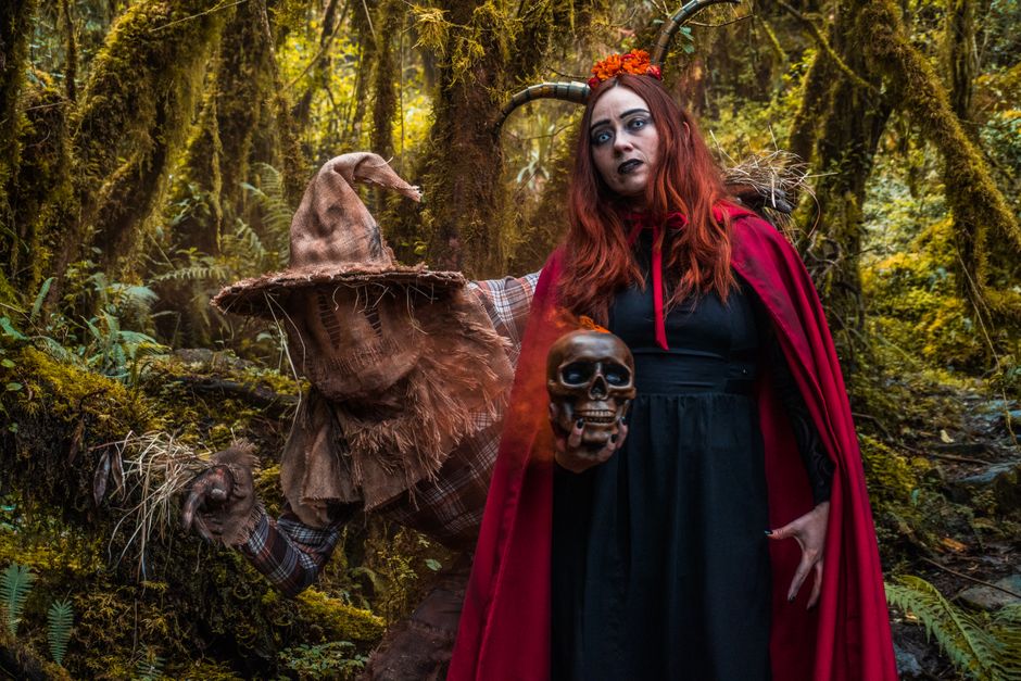 Creepy Halloween characters wearing costumes in Choachí's eerie forest setting.