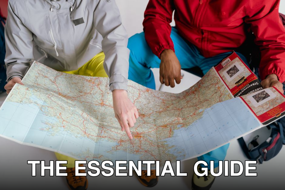Two travelers examining a detailed map for a winter hiking adventure.