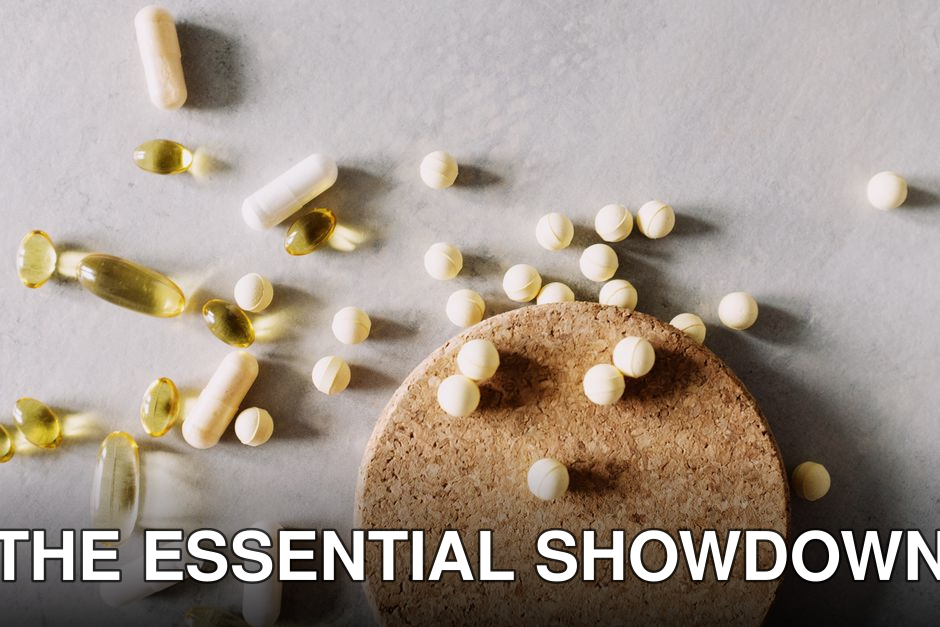 A mix of various capsules and pills scattered on a cork surface, depicting healthcare and wellness.