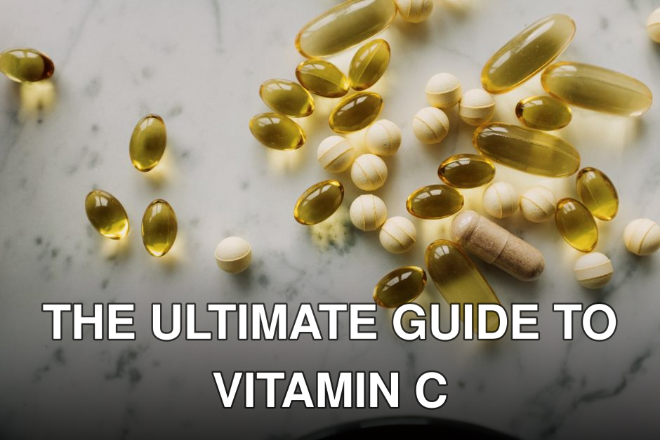 Variety of supplements and capsules scattered on a marble surface, suitable for healthcare themes.
