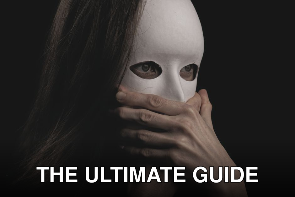 Close-up of a woman in a white mask, hands covering mouth, evoking mystery and drama.
