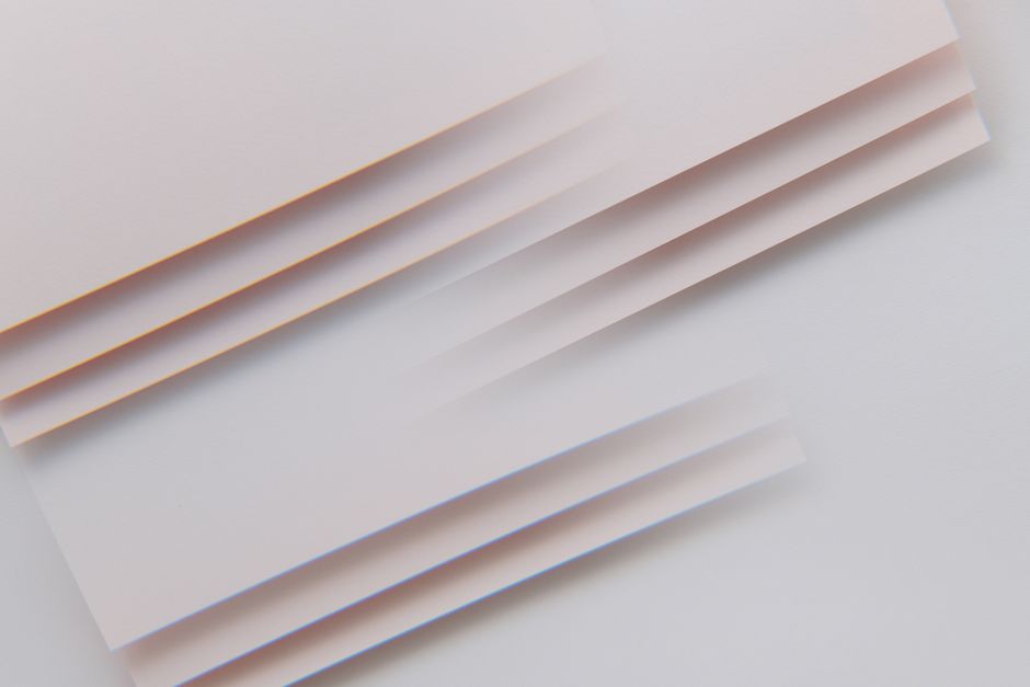 Minimalist abstract image featuring layered stripes with pastel tones, perfect for design and backgrounds.