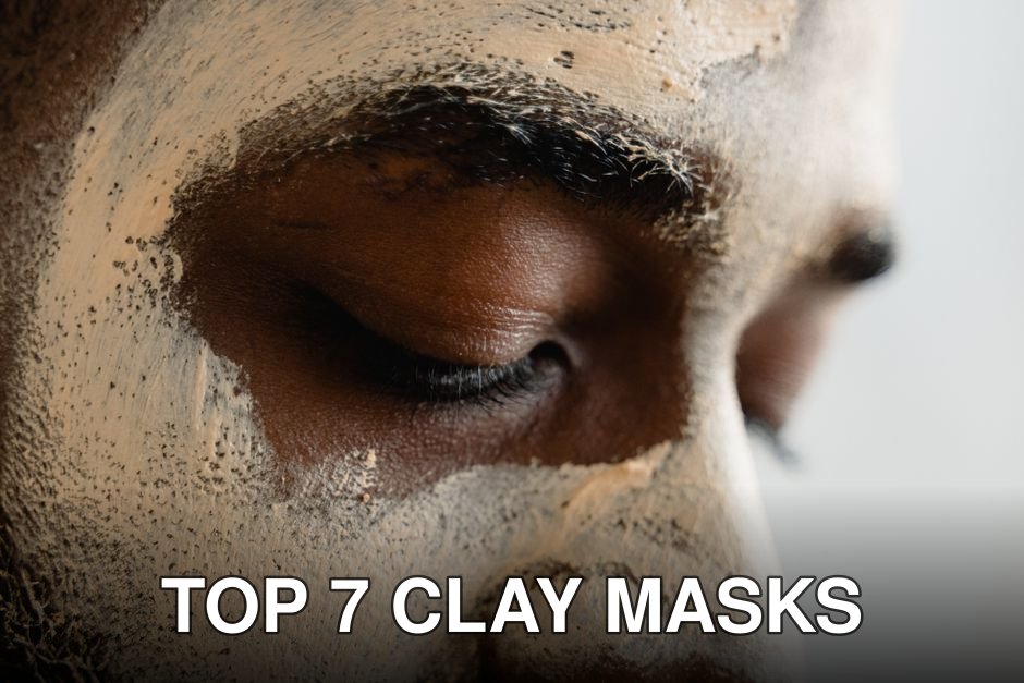 Close-up of a person applying facial clay mask for skincare routine.