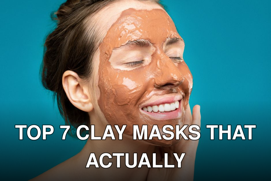 Close-up of a woman smiling with a clay mud mask on her face on a turquoise background.