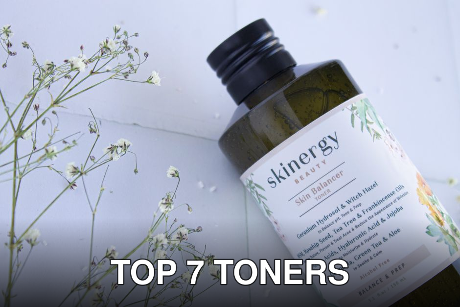 Close-up of a Skinergy toner bottle surrounded by delicate flowers, showcasing its natural essence.