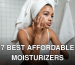 A young woman in a bathroom applying skincare cream with a towel on her head, focusing on self-care.