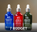Three vibrant ampoule bottles for skincare solutions, ideal for cosmetic product showcases.