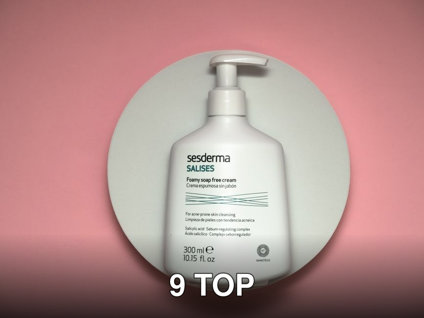 White pump bottle of Sesderma skincare on a pink surface, top view.