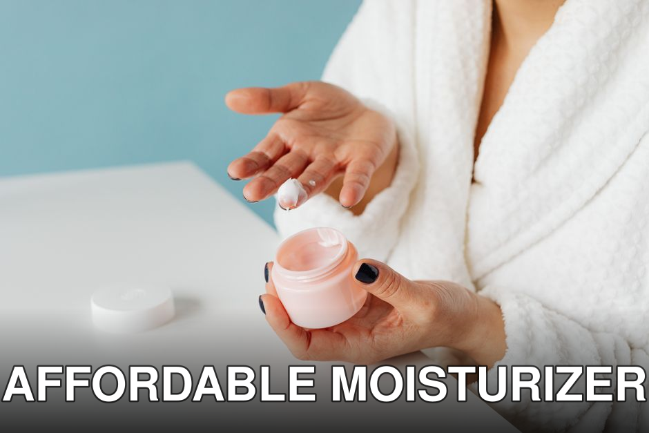 A woman in robe applying skincare cream from an open jar, highlighting moisturizing routine.