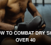Close-up of a muscular boxer putting on gloves, ready for training.