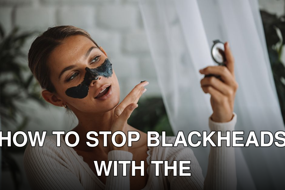 Woman applying black peel-off face mask while looking in a mirror indoors.