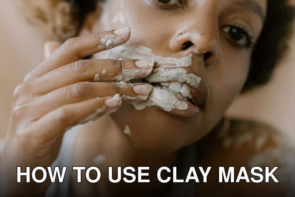 A woman applying a clay mask on her face in a close-up shot, emphasizing skincare.