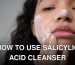 A woman applying skincare cream on her face, focusing on self-care and beauty routines.