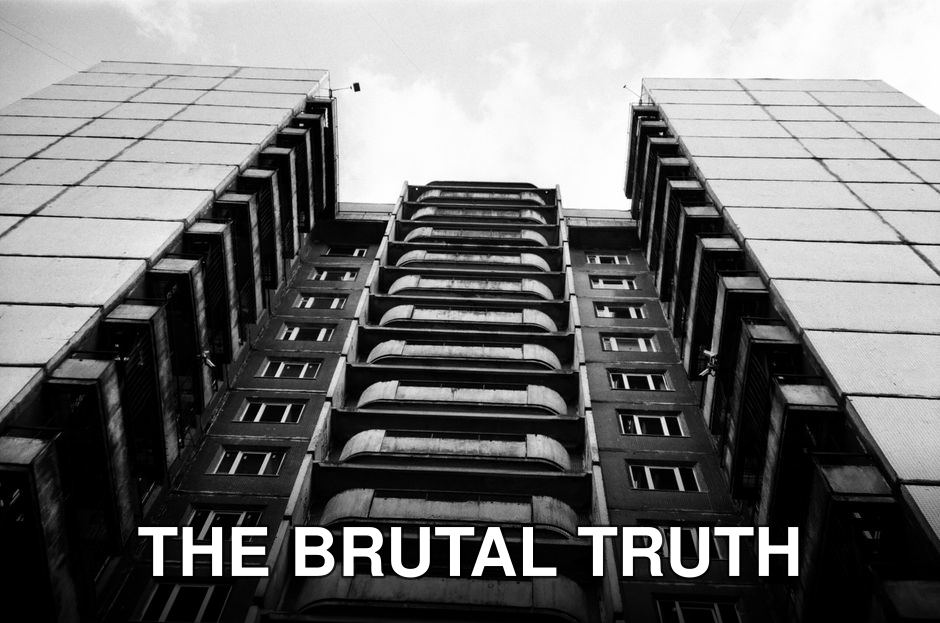 Striking low-angle view of a city building in monochrome highlighting urban architecture.